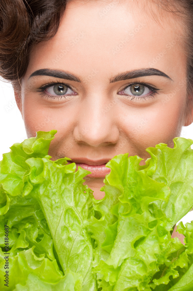 Closeup portrait of emotional beauty woman with green lettuce Closeup portrait of emotional beauty woman with green lettuce