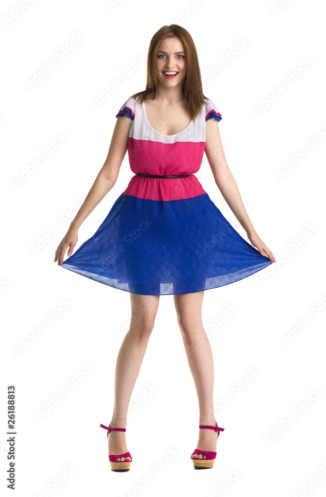 young beautiful happy woman in colored dress isolated
