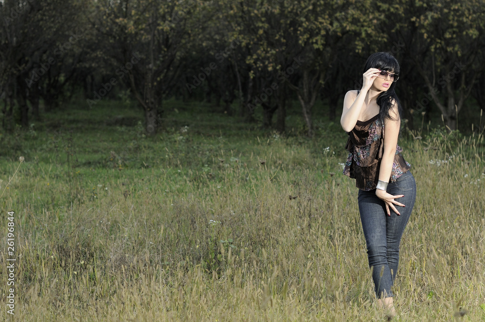 young woman posing with sunglasses