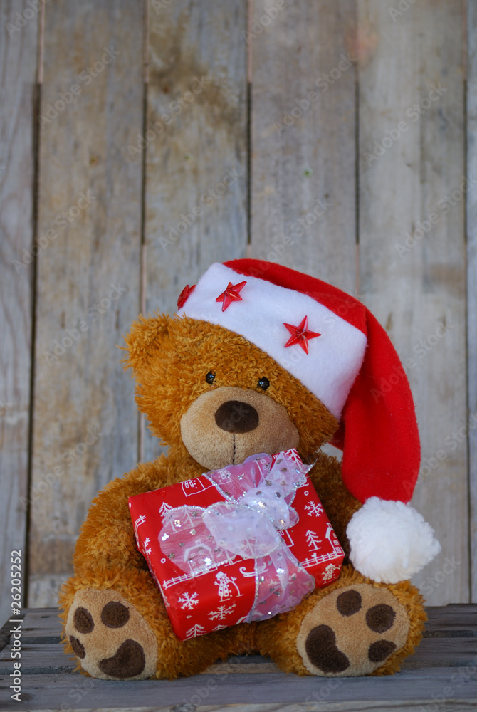 Obraz premium petit ourson de Noël et son cadeau