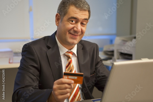 Businessman shopping online photo