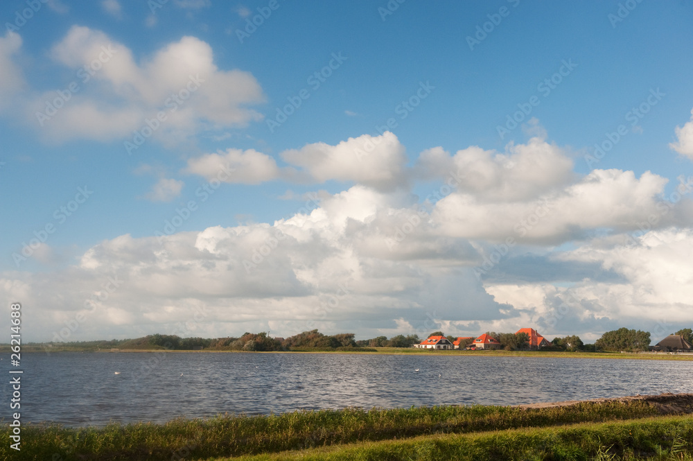 Dutch landscape with water and farmhouse