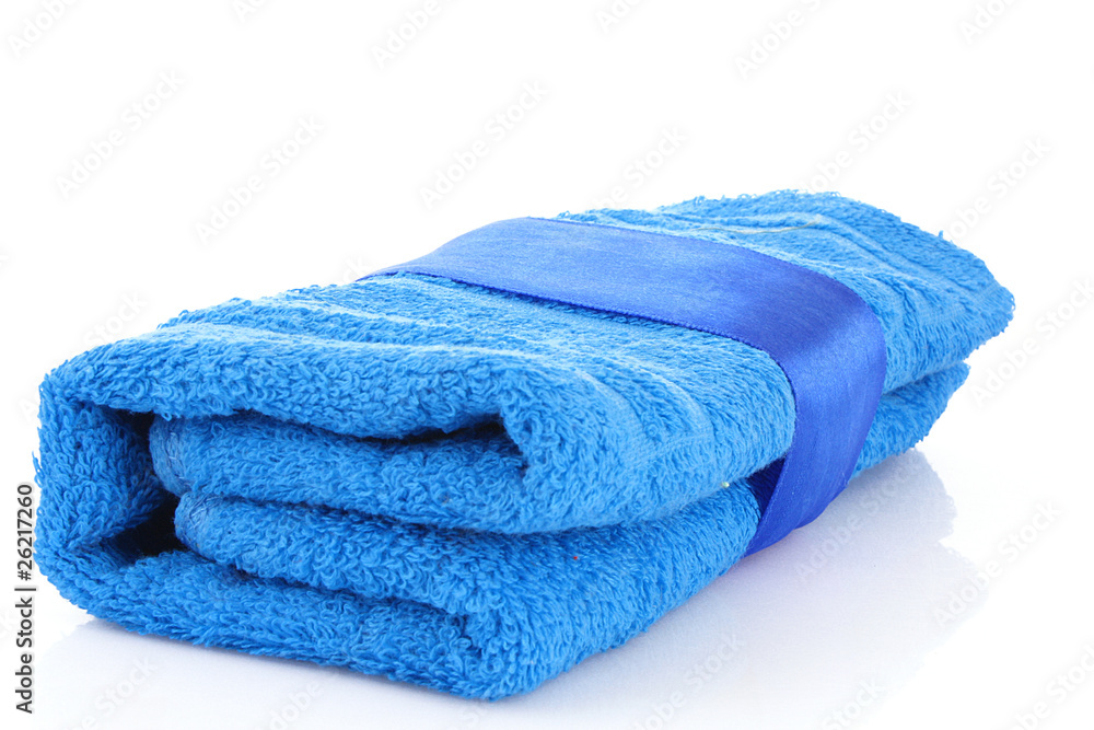 Folded blue towel with the band isolated on white Folded blue towel with the band isolated on white