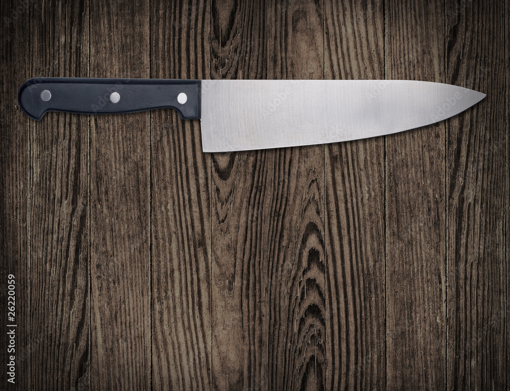 Kitchen knife on wooden table. Kitchen knife on wooden table.