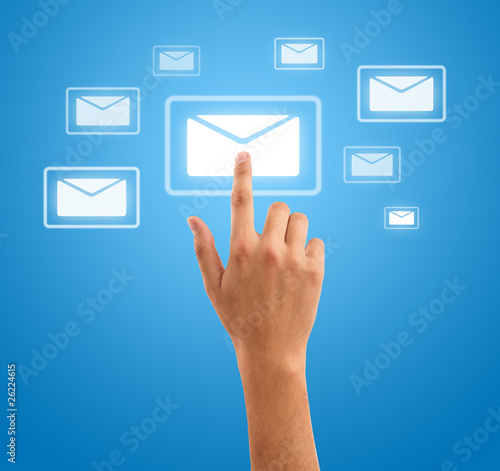 hand pressing futuristic mail symbol on blue background