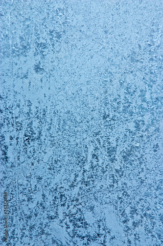 frost pattern on window glass - abstract winter background
