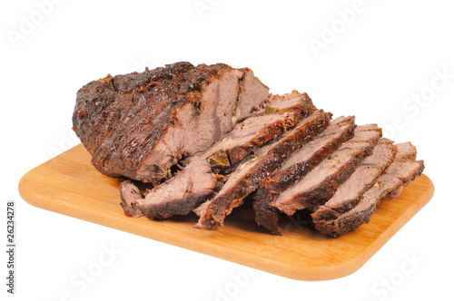 Roast beef on a wooden board