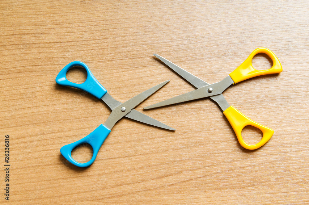 Various scissors on the wooden background Various scissors on the wooden background