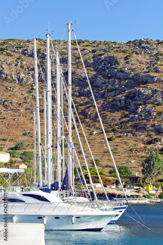 White yachts or sailbouts on an anchor in harbor