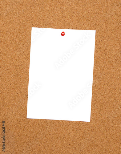 Bulletin board with empty white sheet of paper