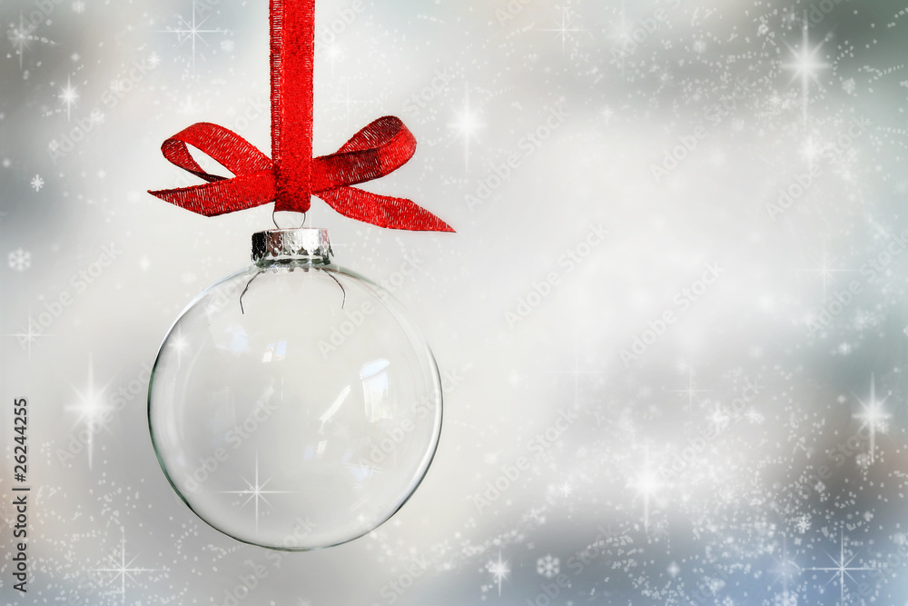 Transparent Christmas ball ornament on snowy background - obrazy, fototapety, plakaty 