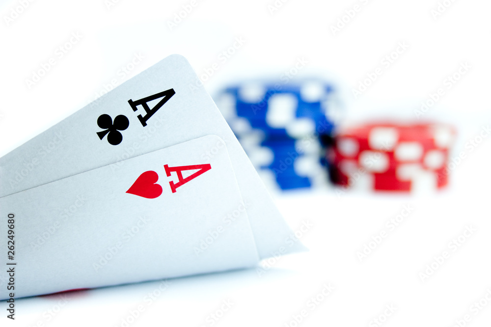 Obraz premium Two aces and pile of casino chips isolated on white background