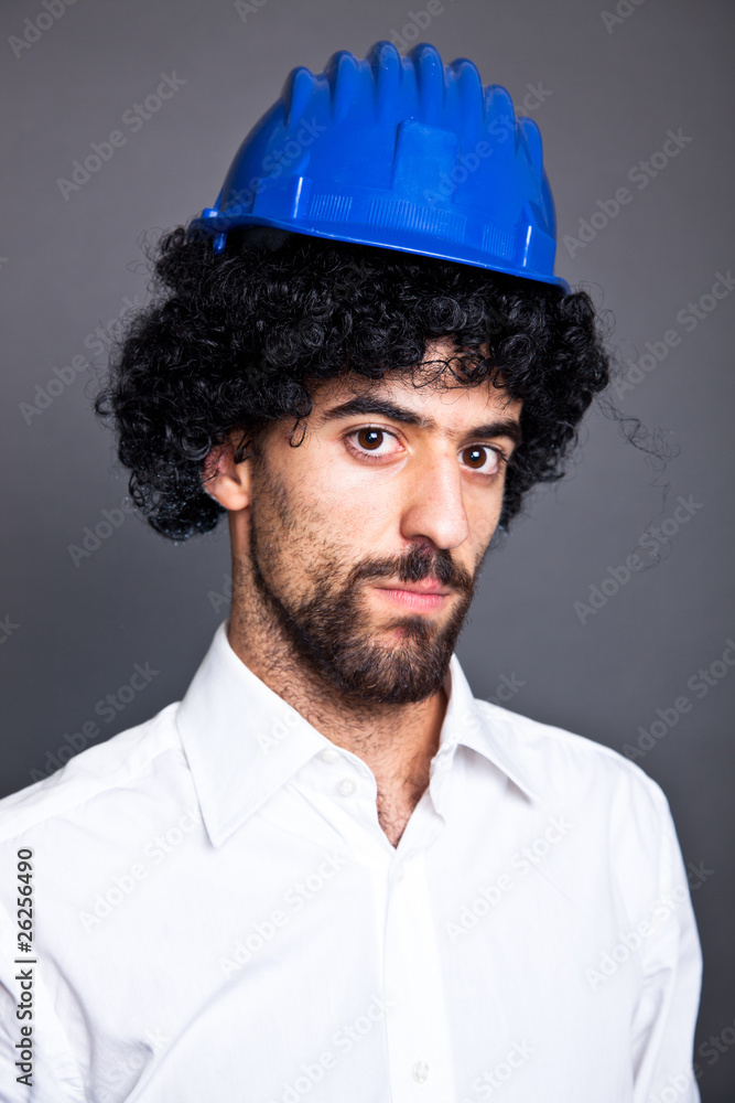 Young Man with Wig and Protective Helmet Young Man with Wig and Protective Helmet