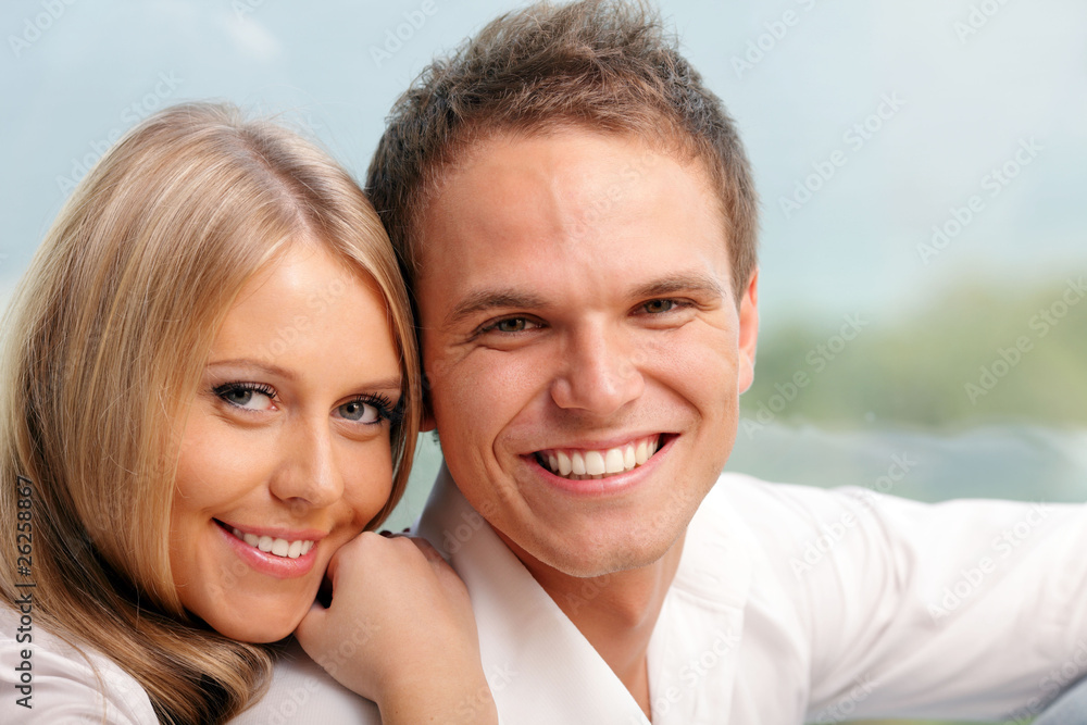 Young happy couple hugging at home Young happy couple hugging at home
