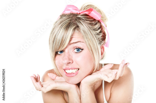 Tableau sur toile Young beautiful blond woman with pink bow apologizing
