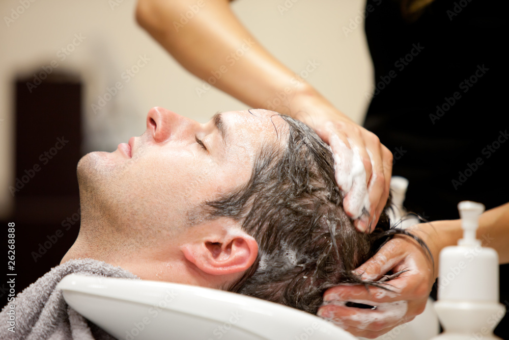 Handsome man shampooed by his hairdresser Stock Photo | Adobe Stock