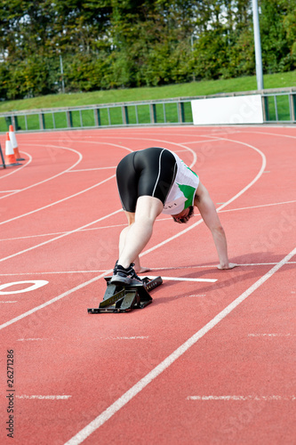 Concentrated man waiting in starting block
