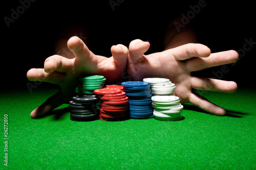 Fotografie All In (Male Hands Pushing Poker Chips)