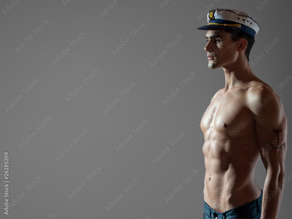 very attractive man top naked with a sailor cap, great body Stock Photo |  Adobe Stock