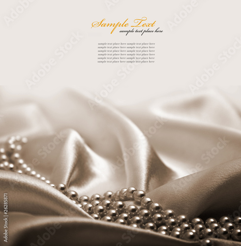 Pearls a necklace on a silk fabric