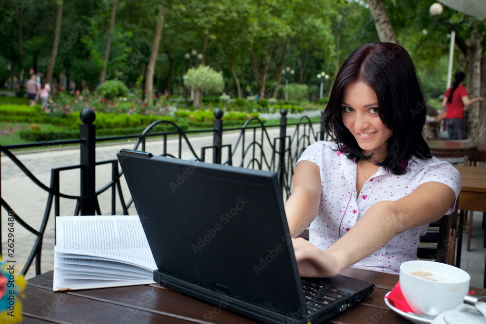 girl with laptop in cafe girl with laptop in cafe