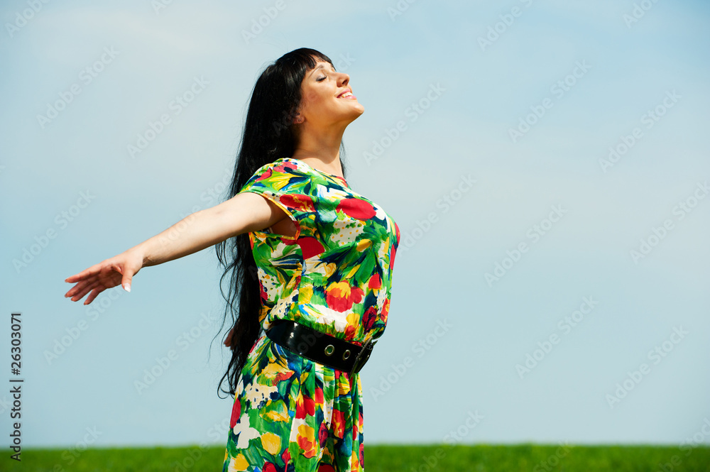 happy woman against blue sky