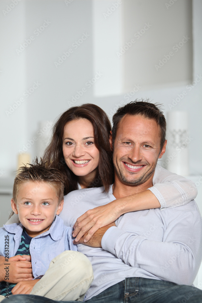 Closeup of parents and child relaxing at home on sofa Closeup of parents and child relaxing at home on sofa