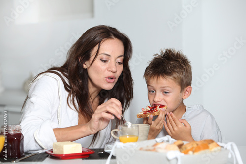 Mother and son having breakfast