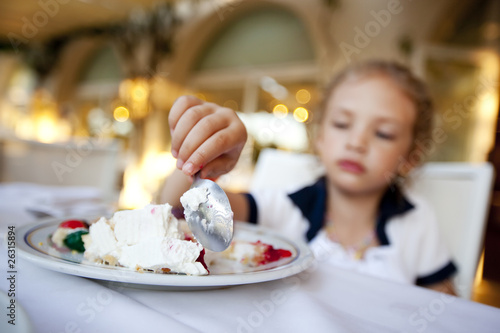 girl eats a ceke. focus on spoon