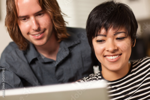 Happy Young Man and Woman U...
