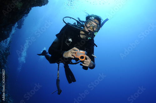 scuba diver on a wall dive