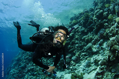 scuba diver on a wall dive