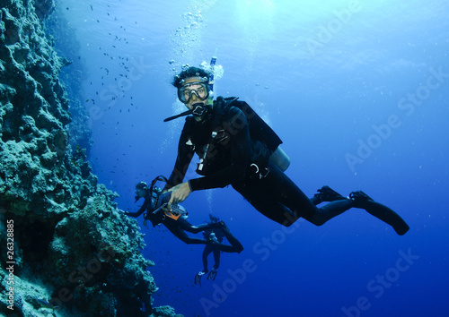 scuba diver on a wall dive
