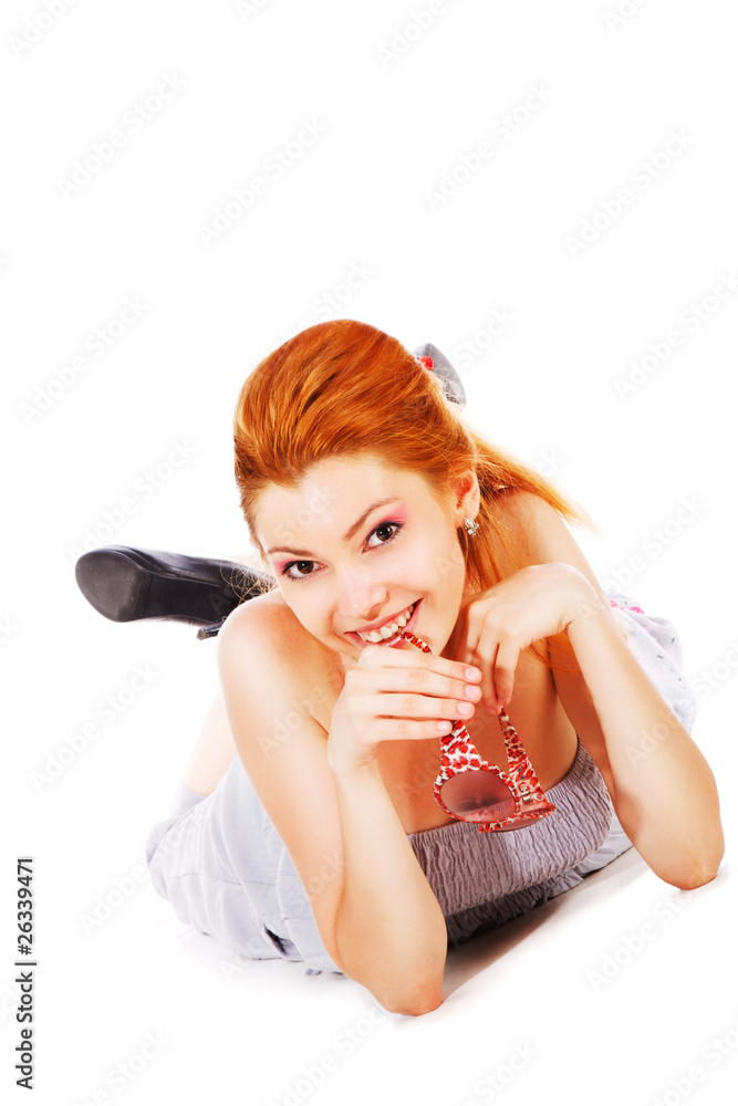 Beautiful young smiling woman in grey on floor Beautiful young smiling woman in grey on floor