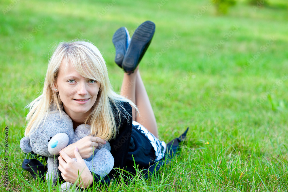 Fototapeta premium .Girl relaxing on the meadow against