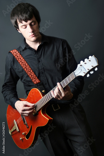 Guitarist. Guitar playing. photo