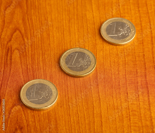 euro coin on wood