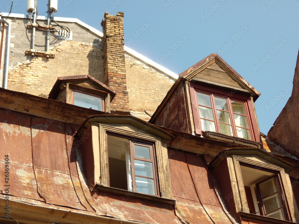 Old masard roof with four dormers