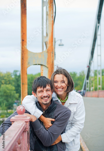 Young beautiful couple having fun in the autumn walk