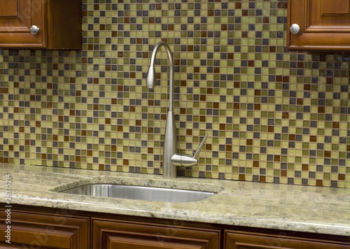 Stainless steel kitchen faucet and sink with mosaic backsplash
