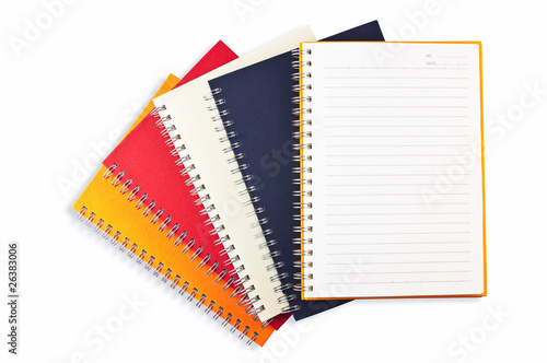 Open blank page note book placed on the top of group note book