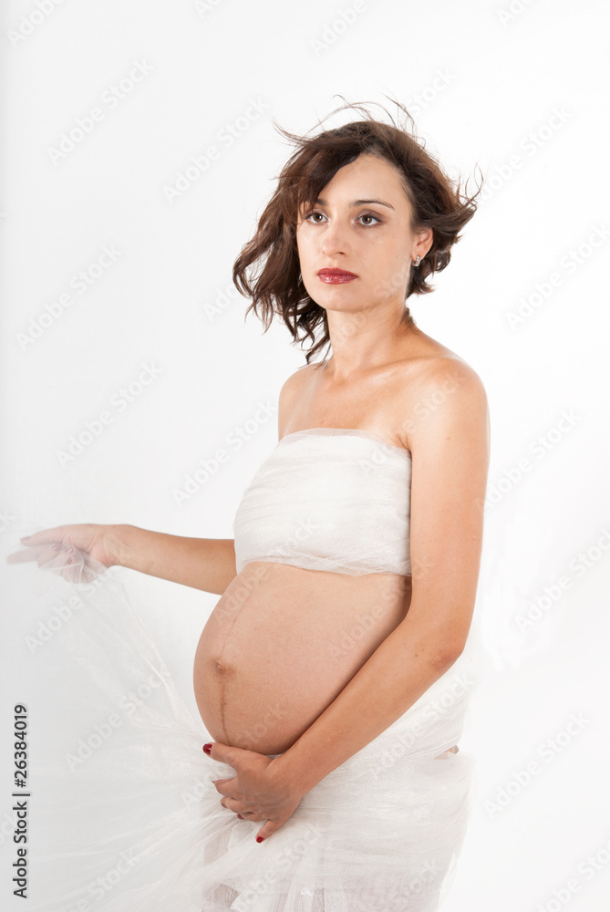 Beautiful young pregnant mother isolated on white Beautiful young pregnant mother isolated on white