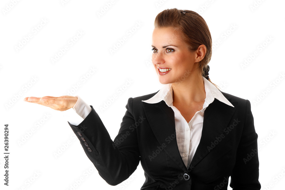 smiling modern business woman presenting something on empty hand smiling modern business woman presenting something on empty hand