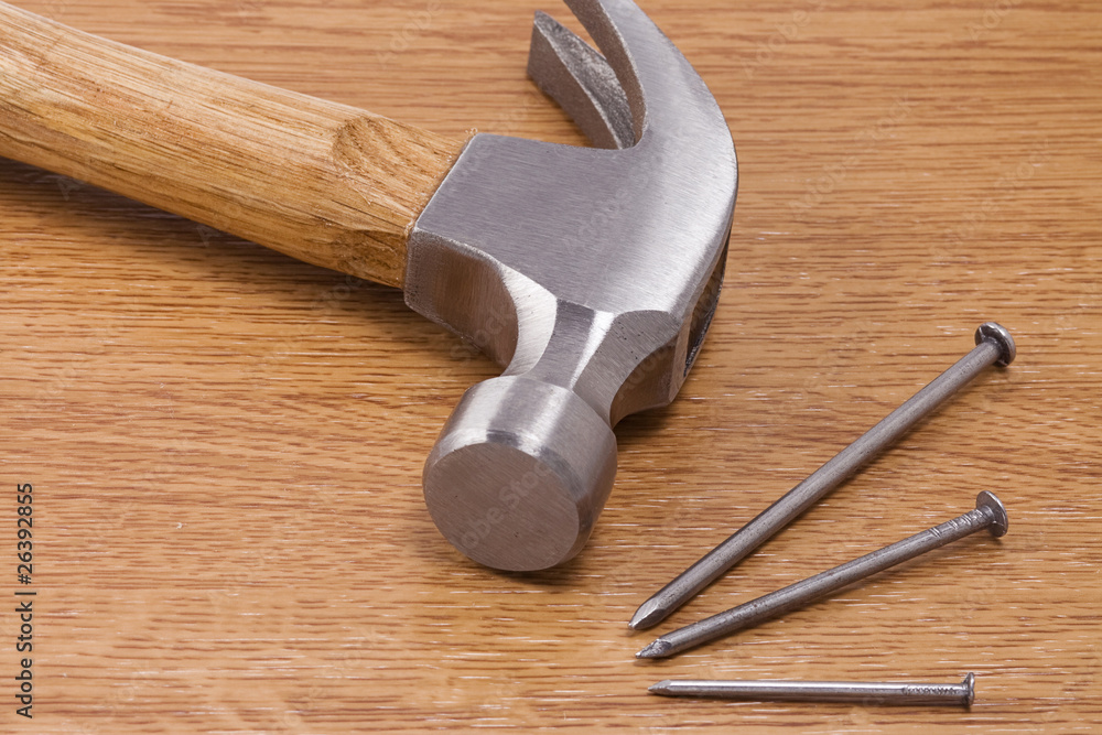 hammer and nail on wood