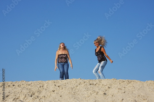 Two beautiful girls on nature photo