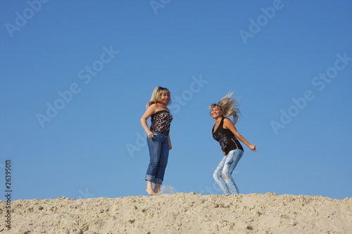 Two beautiful girls on nature photo