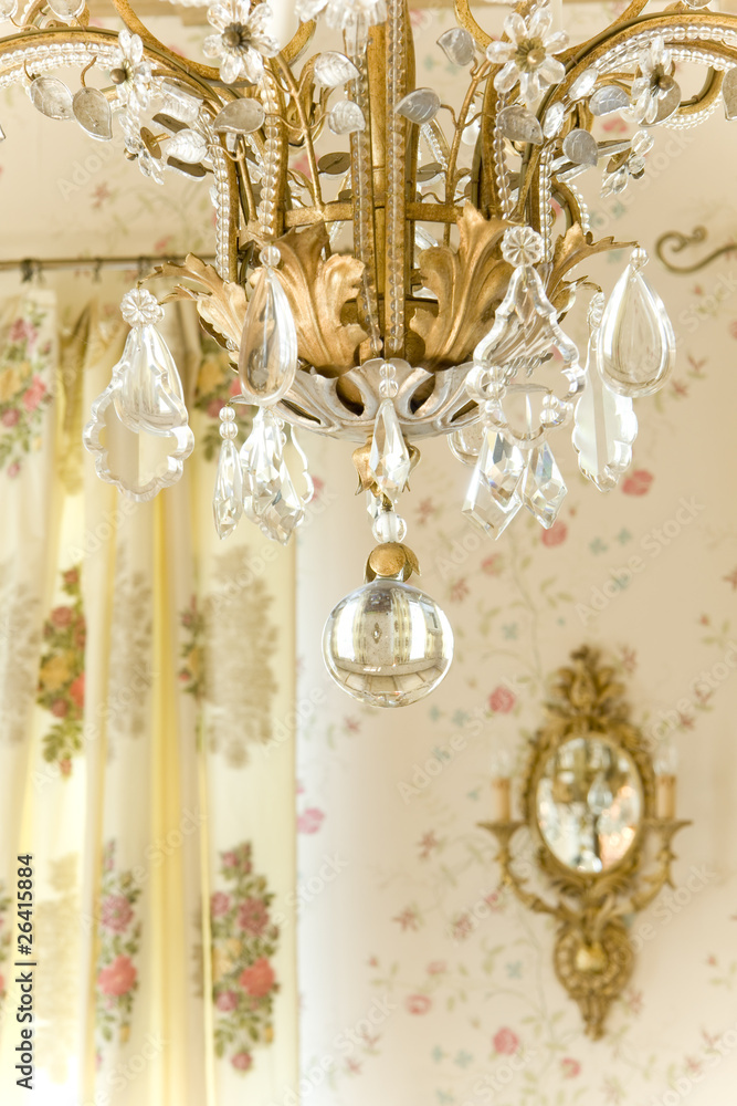 chandelier and sconce on the wall