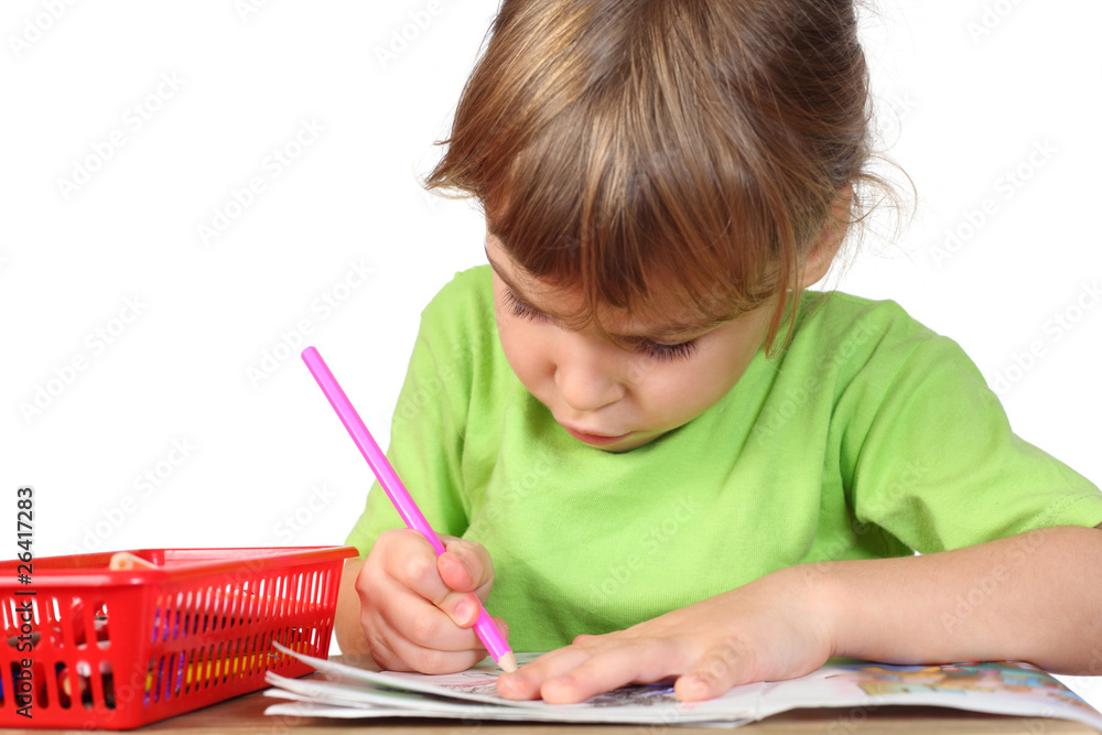 little girl in green shirt painting in notebook little girl in green shirt painting in notebook