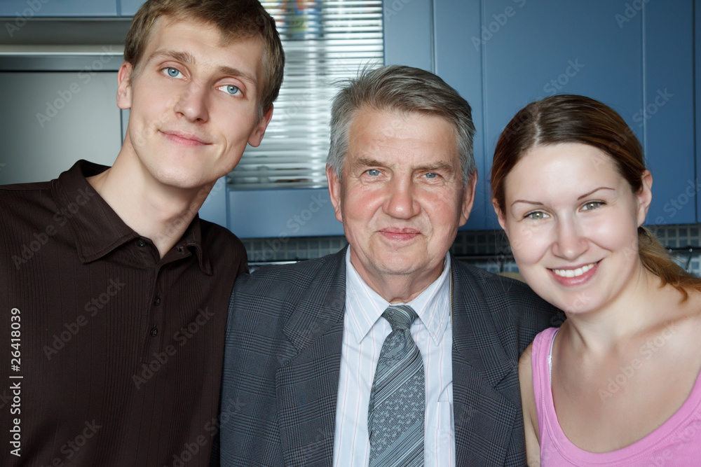 Family of three people. Man, old man and girl smiling