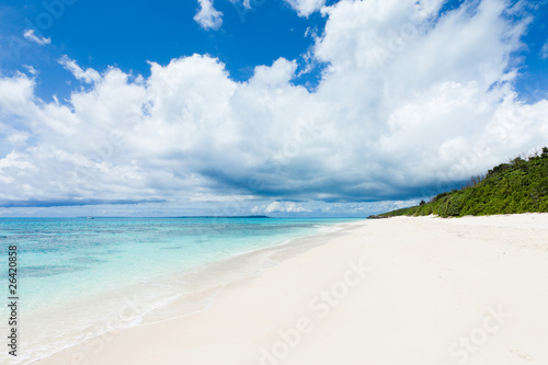 Fototapeta Naklejka Na Ścianę i Meble -  White sand beach on deserted tropical island with clear water